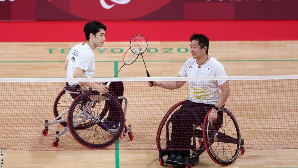 Japan's Daiki Kajiwara and Hiroshi Murayama celebrate a point in Para-badminton