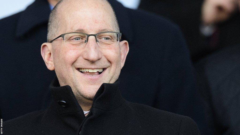 Major investor Harvey Jabara watches Lincoln City in action from the stands