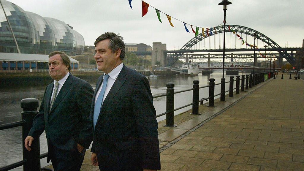 John Prescott walking with Chancellor Gordon Brown along the quayside of the River Tyne in Newcastle, while campaigning for devolution for the English regions in a referendum in the North-East in 2004