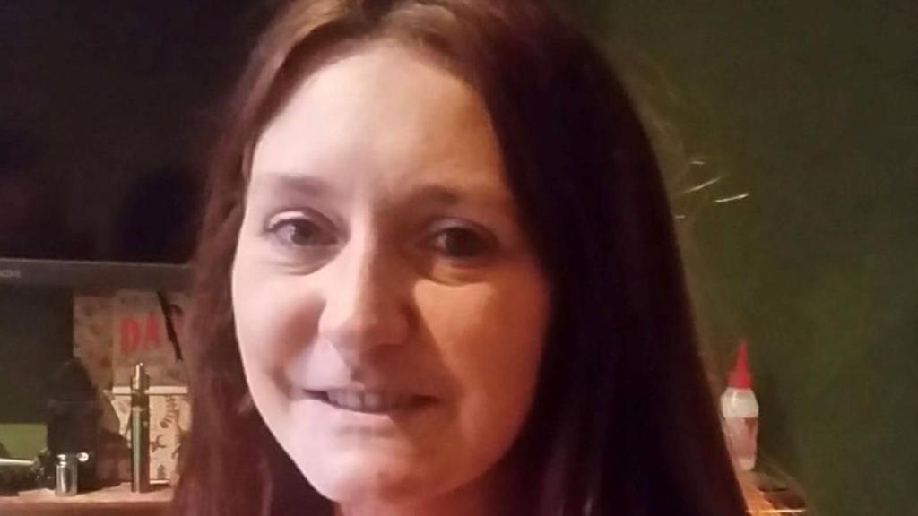 Natalie Jones, found dead with a 47-year-old man, wears a red jumper and has long brown hair