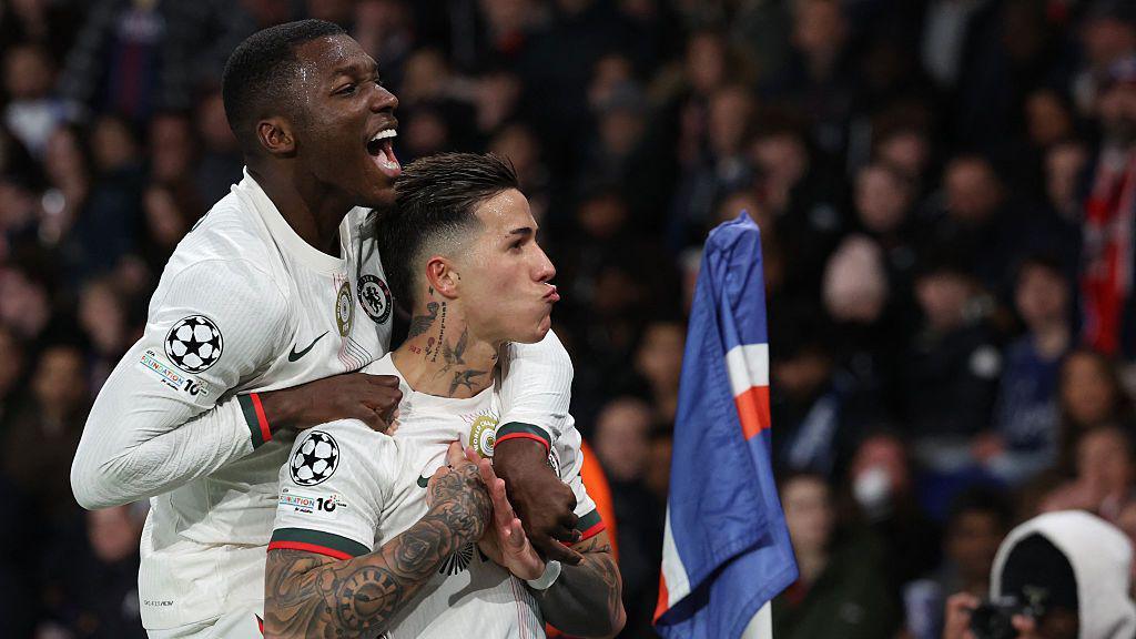 Moises Caicedo jumps on Enzo Fernandez's backs