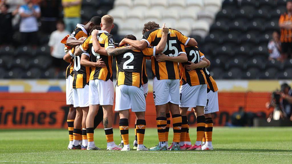 Players of Hull City huddle prior to the pre-season friendly