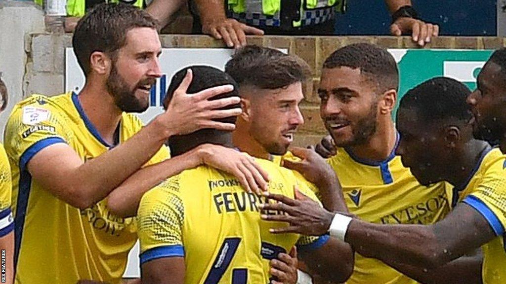 Fiacre Kelleher (left) scores for Colchester