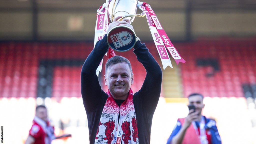 Richie Wellens lifts the League Two trophy