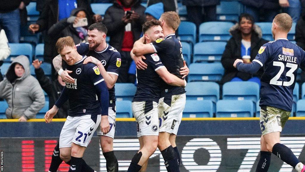 Millwall celebrate a Tom Bradshaw goal at The Den