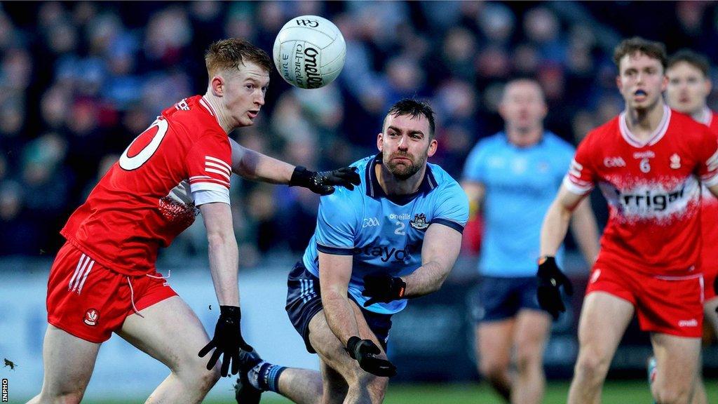 Derry’s Declan Cassidy challenges Dublin defender Seán MacMahon in Saturday evening's game