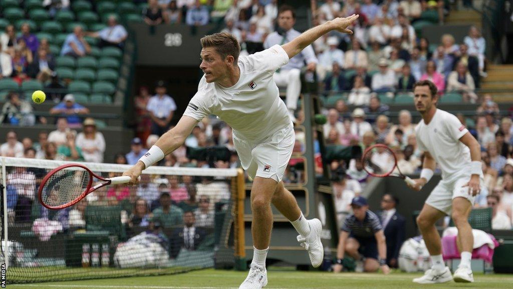 Neal Skupski playing at Wimbledon with partner Wesley Koolhof