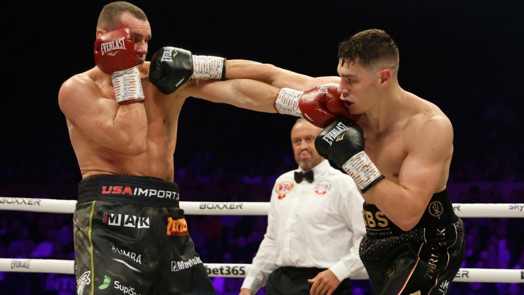 Chris Billam-Smith aims a punch at Mateusz Masternak