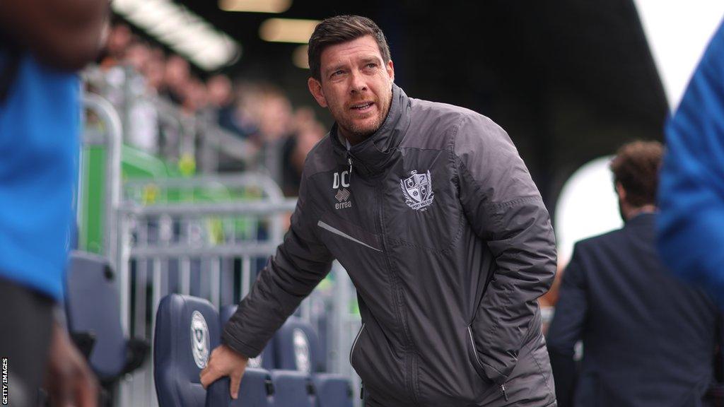 Darrell Clarke in the dugout during a Port Vale game last season