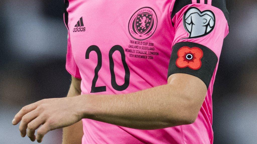 A Scotland player wearing a poppy