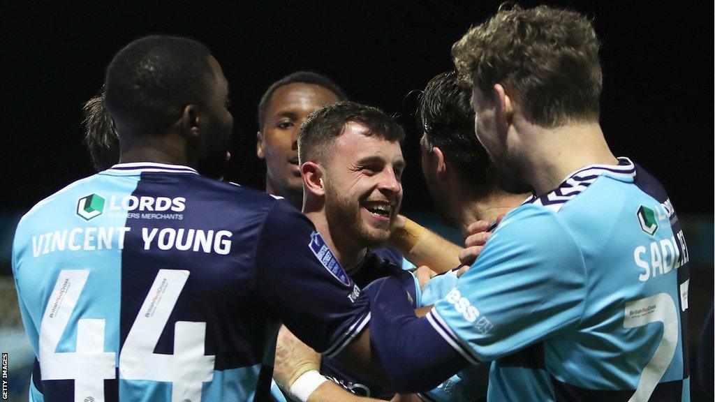 Wycombe congratulate Dale Taylor following Wycombe's fourth goal