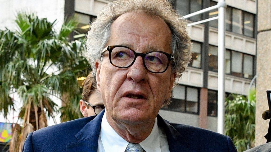 Geoffrey Rush arriving at court