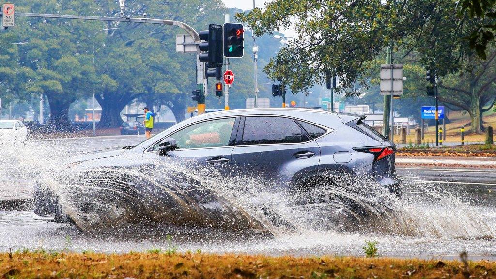 car-driving-through-floods-australia.