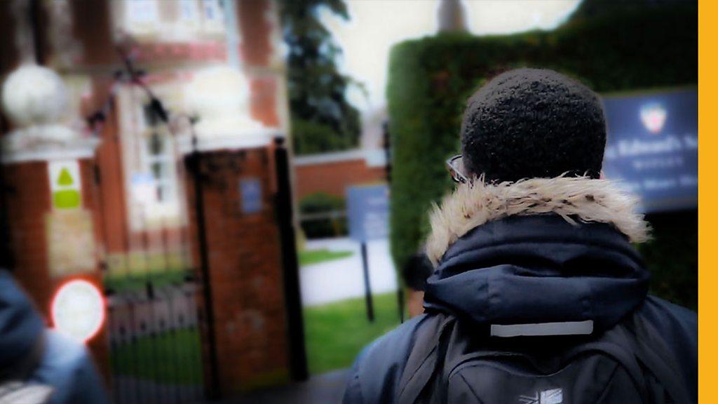 A boy outside a school