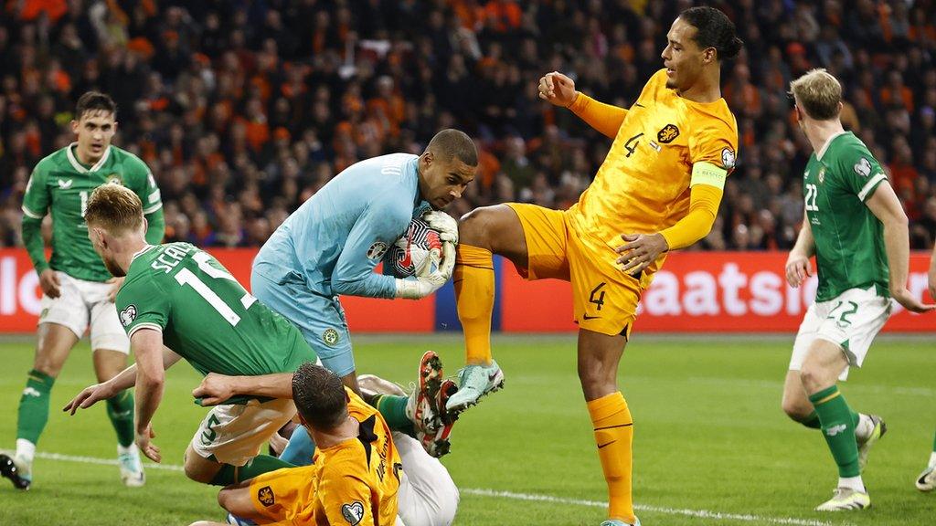 Republic keeper Gavin Bazunu beats Dutch captain Virgil van Dijk to the ball in Amsterdam