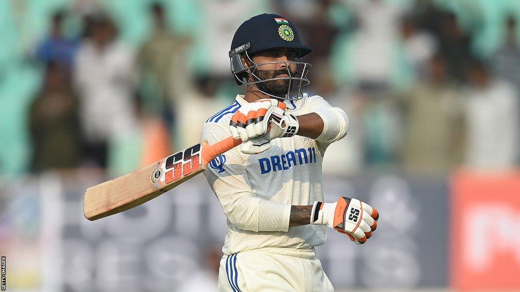 India's Ravindra Jadeja celebrates hitting a century