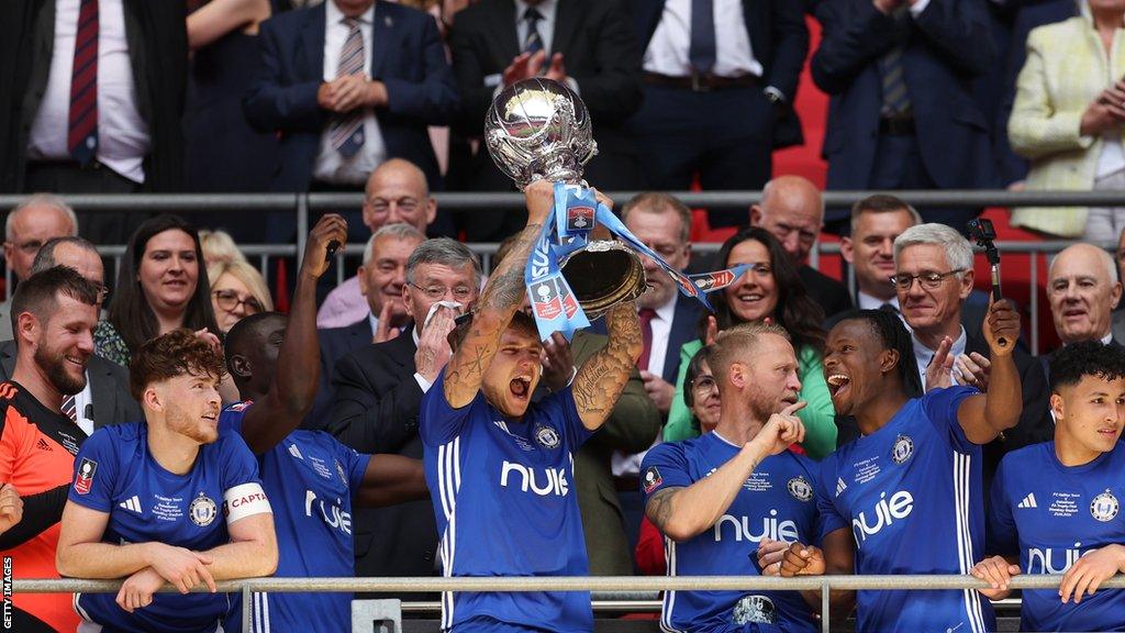 FC Halifax Town players lift the FA Trophy