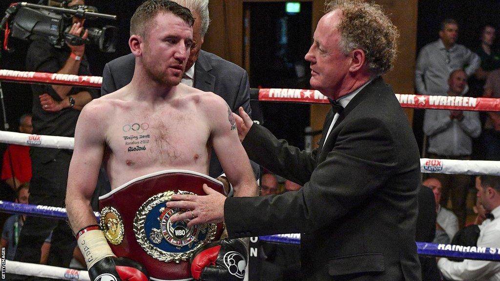 Hugh Russell, in his British Boxing Board of Control role, presents Paddy Barnes with the WBO European flyweight belt in 2017