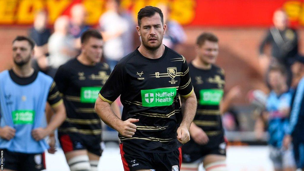 Mark Atkinson on the field with team-mates before a Premiership game this season