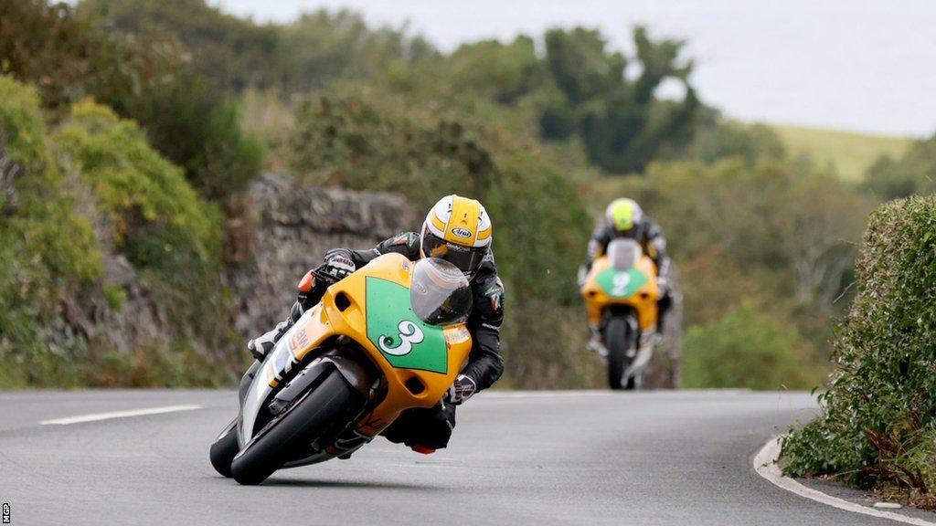 Mike Browne followed by Ian Lougher on the course during the Lightweight Manx GP