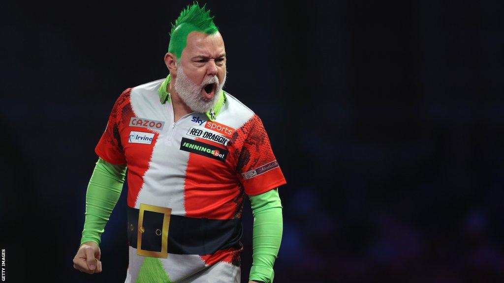 Peter Wright with green hair and a green top