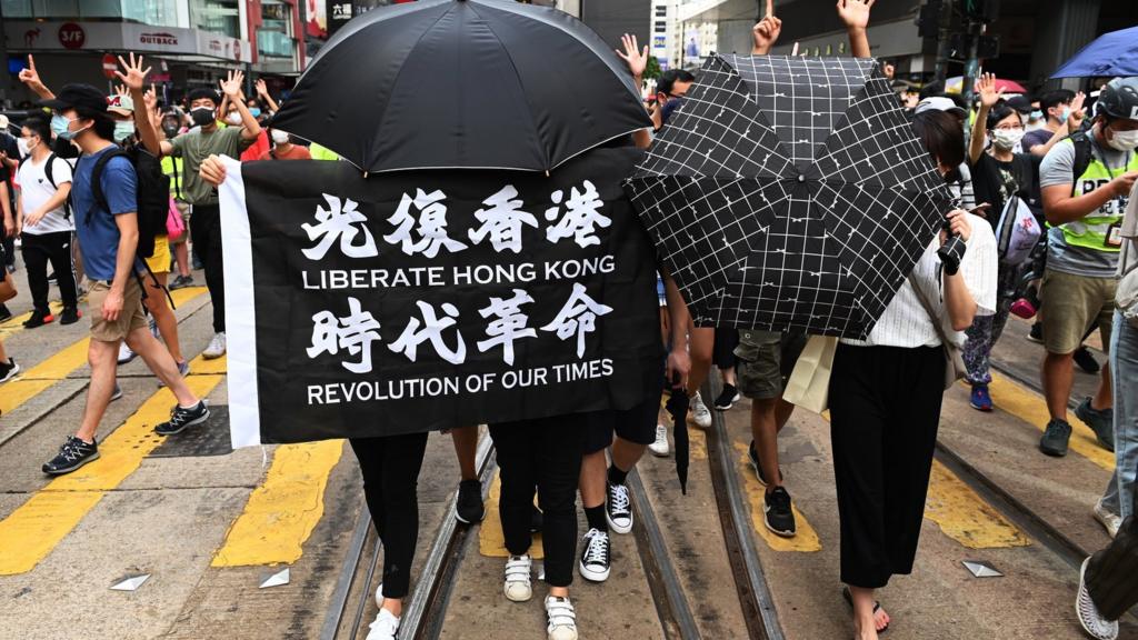 Protesters in Hong Kong on first day of new security law