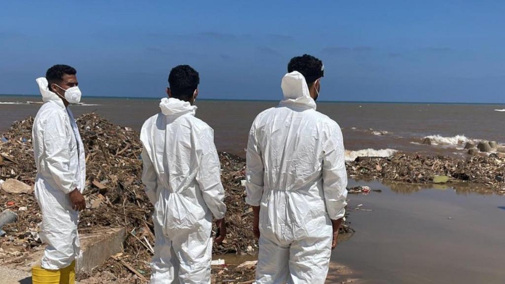 Rescuers in Derna looking at the sea