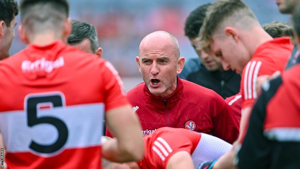 Derry boss Ciaran Meenagh addresses his squad before the quarter-final against Cork