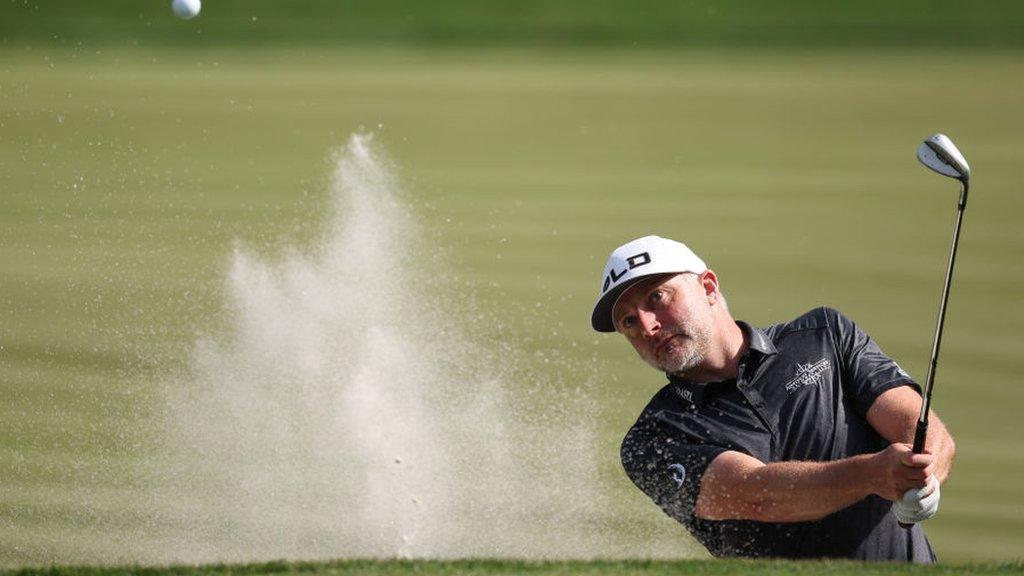 England's David Skinns playing out of a bunker during a practice round at TPC Sawgrass