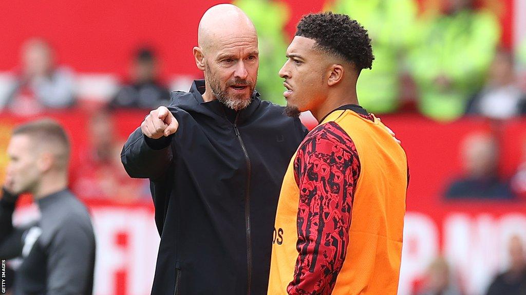 Erik ten Hag talks to Jadon Sancho