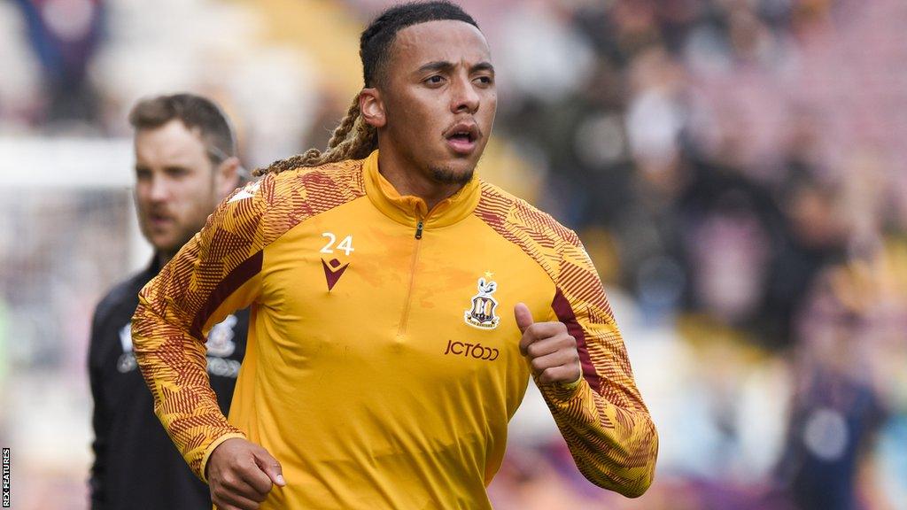 Romoney Crichlow warms up for Bradford City