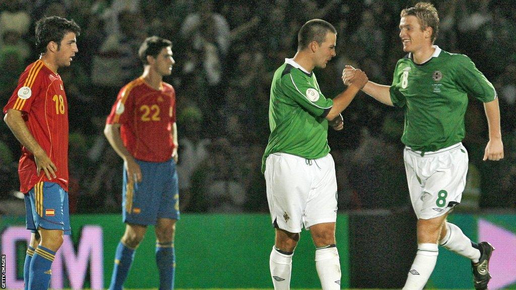 David Healy and Steven Davis celebrate against Spain in 2006