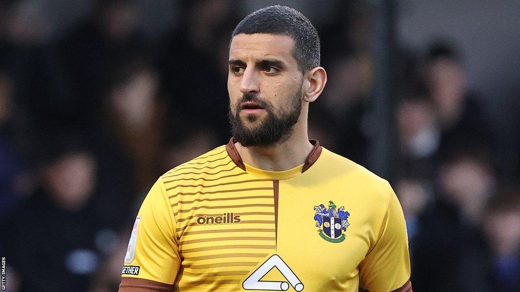 Omar Bugiel in action for Sutton United