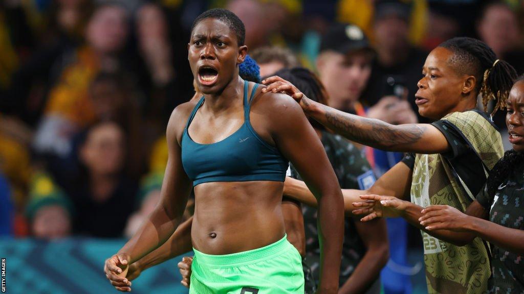 Asisat Oshoala celebrates scoring against co-hosts Australia