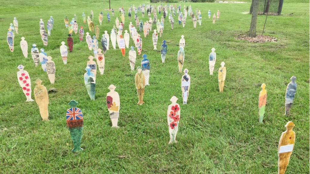 Wooden statues planted at National Memorial Arboretum