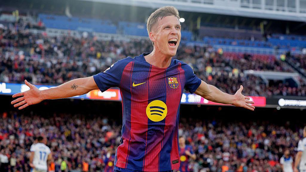 Dani Olmo celebrates scoring for Barcelona against Alaves in La Liga