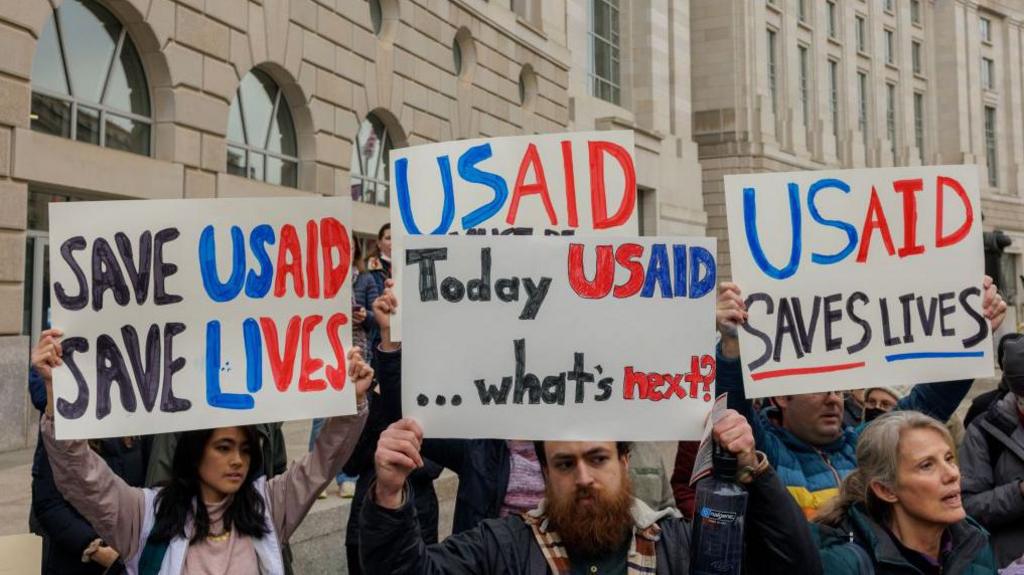 Protesters demonstrate in support of USAID outside the agency headquarters in Washington, DC.