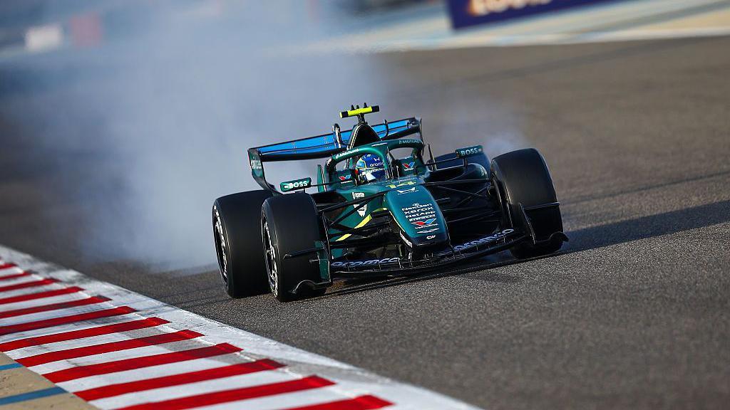 Fernando Alonso locks up in the Aston Martin on track during pre-season testing in Bahrain 
