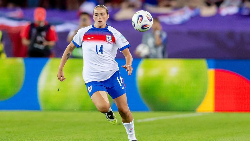 Grace Clinton playing for England against France