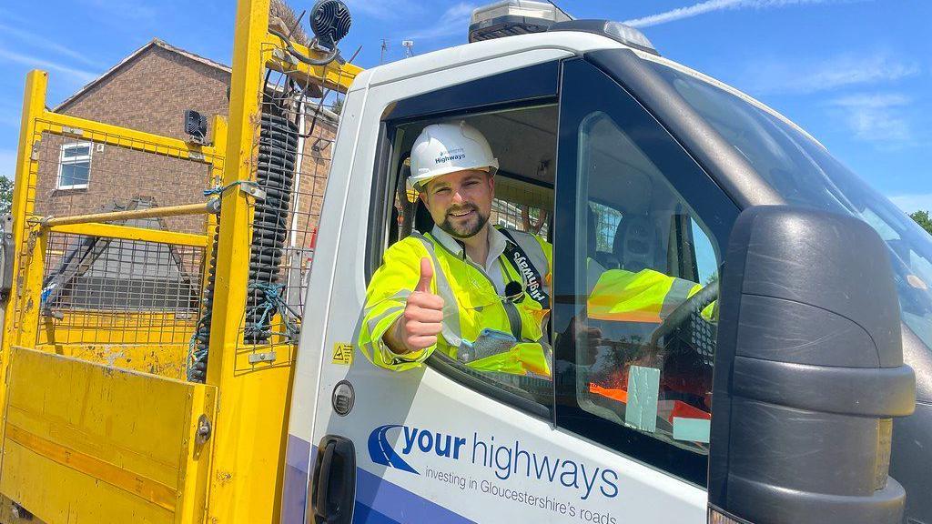 Highways maintenance and communications cabinet member Joe Harris pictured in the driver's seat of a council highways van parked at the Stroudwater Highways depot.
