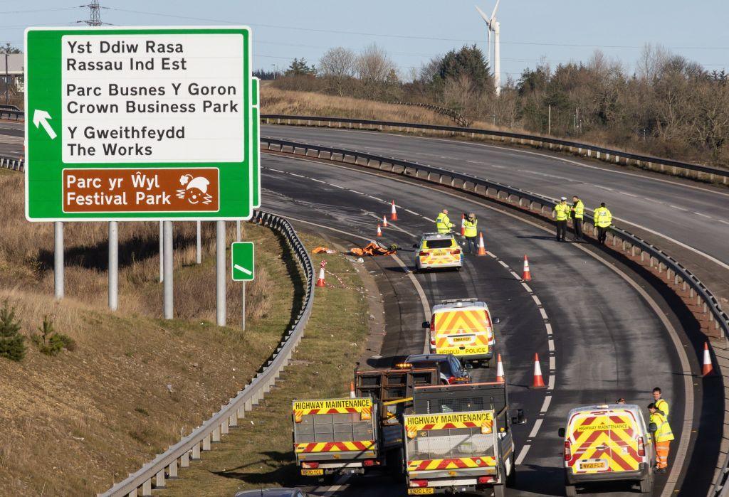 Maintenance vehicles blocked off a dual carriageway road as police investigate a serious crash as bollards block the road