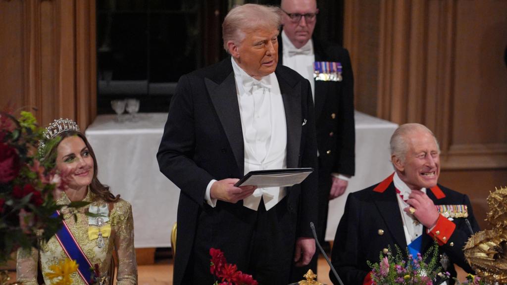 Donald Trump stands up to speak at a state banquet at Windsor Castle, with the Princess of Wales and King Charles seated on either side