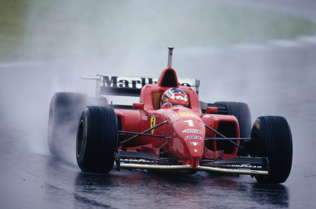 Michael Schumcher steers his Ferrari around a corner in soaking conditions during the 1996 Spanish Grand Prix