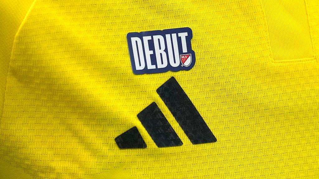 An MLS debut patch on the yellow jersey of a Columbus Crew player