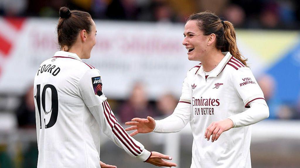 Laia Codina and Caitlin Foord celebrate Arsenal's first goal