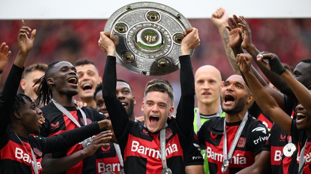 Florian Wirtz celebrates Bayer Leverkusen's first Bundesliga title