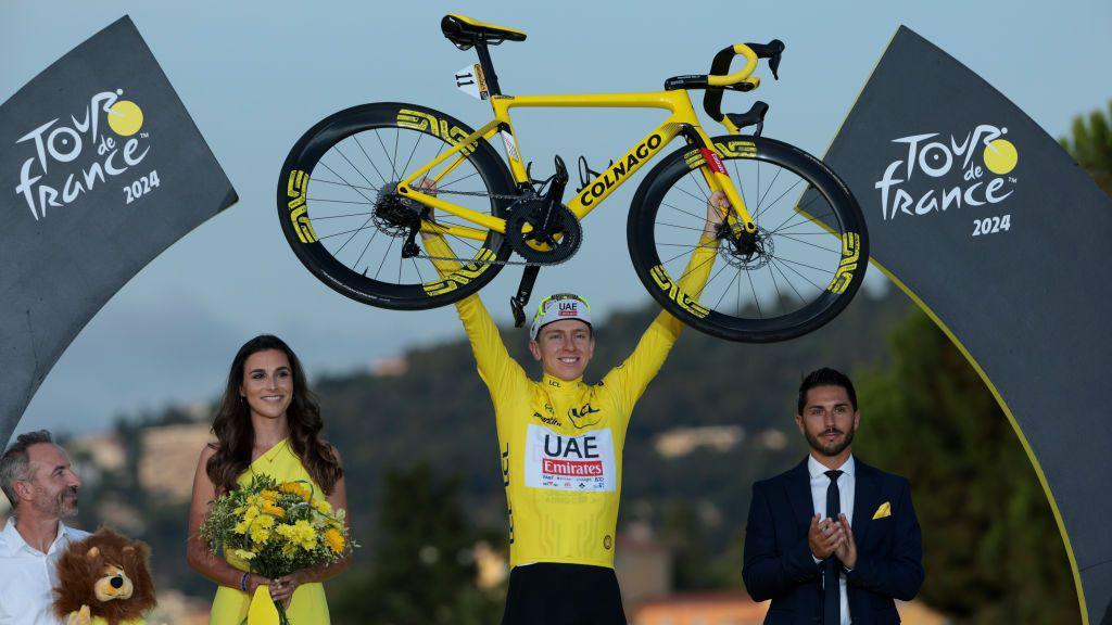 Tadej Pogacar on the podium in 2024.