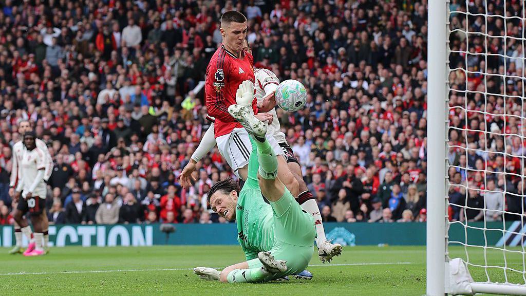 Benjamin Sesko of Manchester United scores his side's second goal past Freddie Woodman of Liverpool during the Premier League match