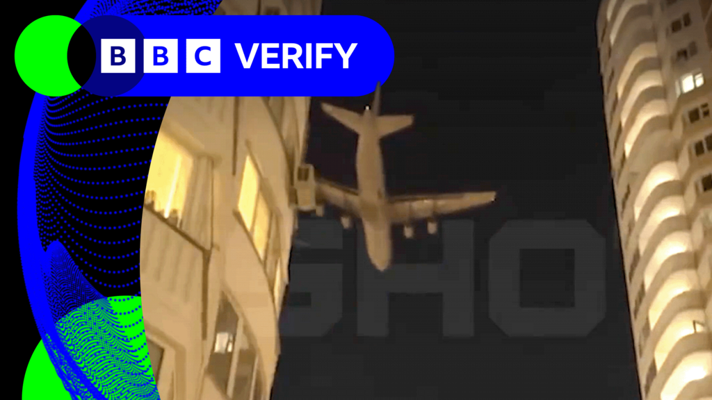 A large aircraft is seen flying low over Moscow on Monday