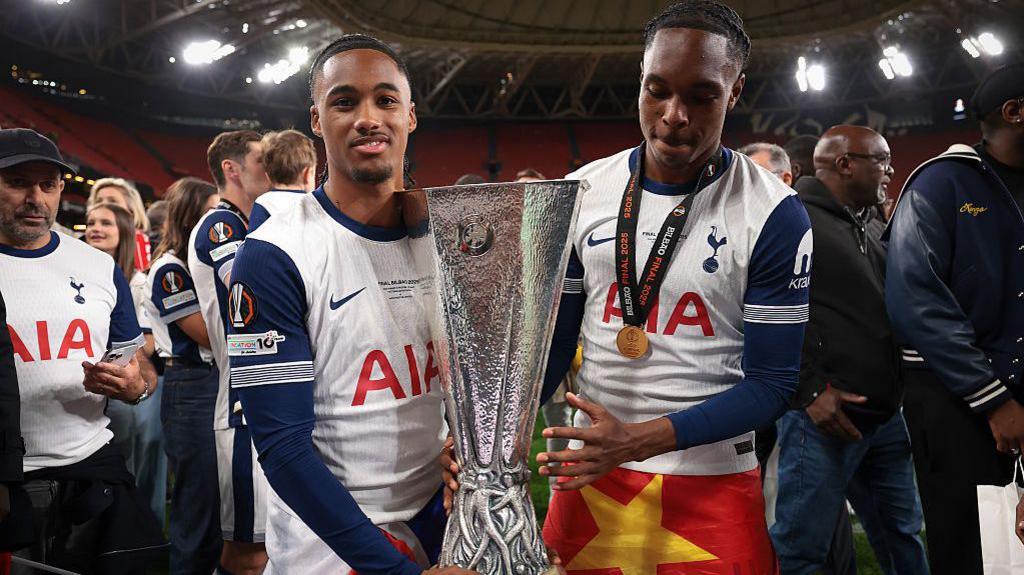 Wilson Odobert and Mathys Tel with the Europa League trophy